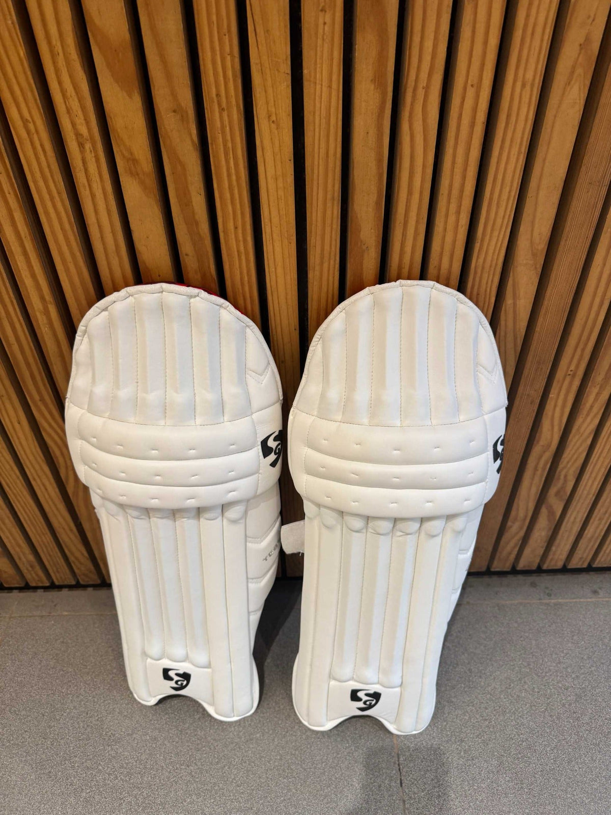 SG Test men's right-hand batting leg guards paired front view