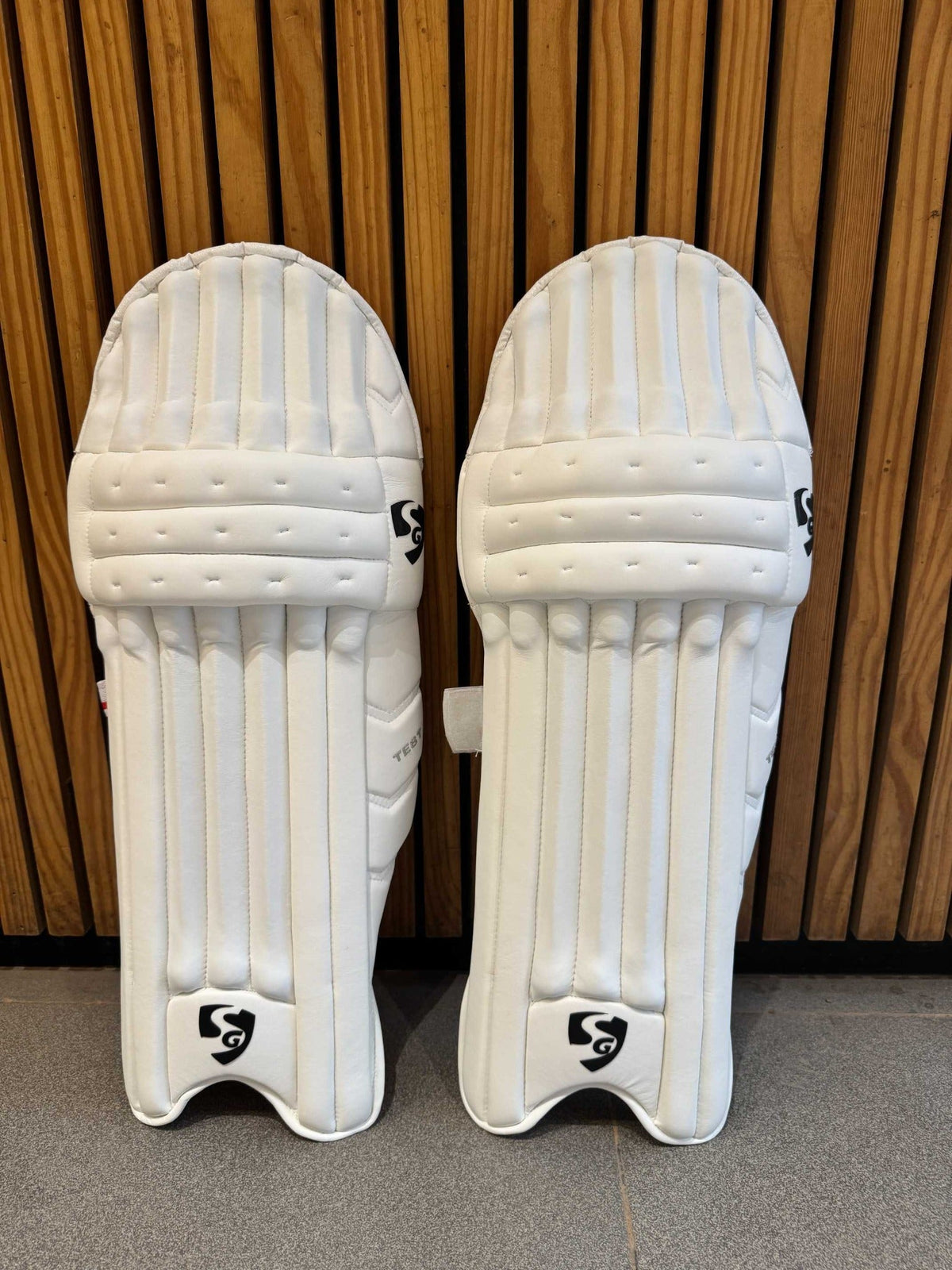 Pair of SG Test men's RH batting leg guards front view