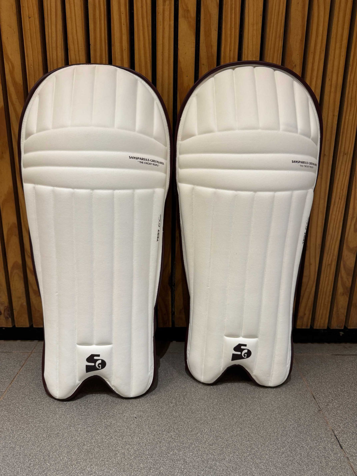 Pair of SG Test Classic ambidextrous batting leg guards in white